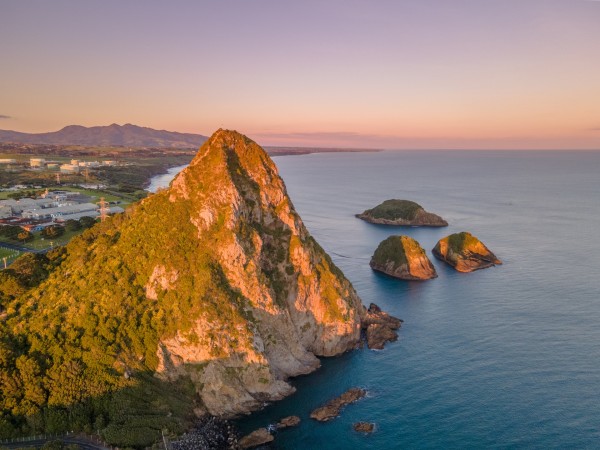 Arial shot of Paritutu Rock and along the coast