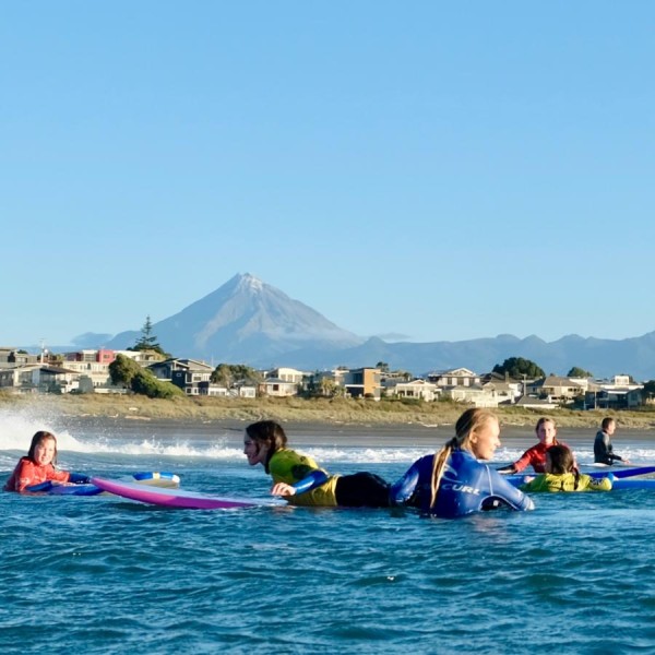 Surf School in action. Taranaki Maunga in background